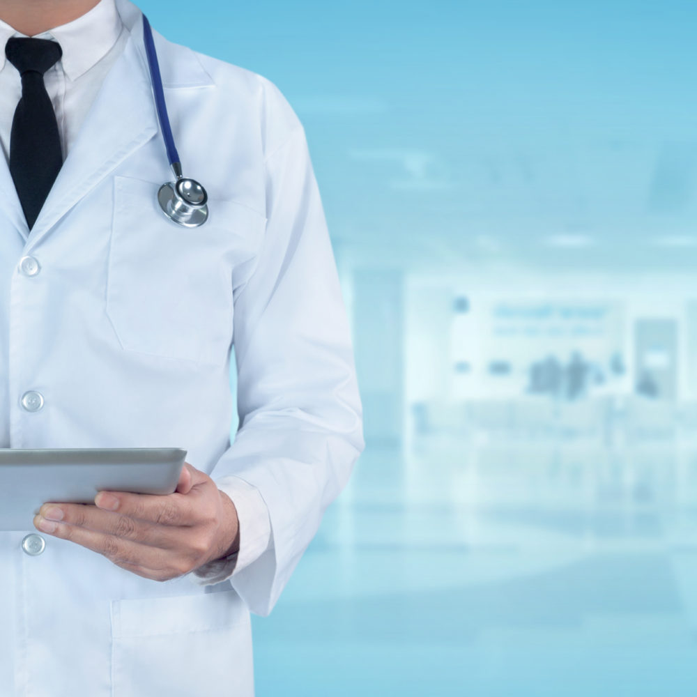 Medicine doctor using a digital tablet in a hospital